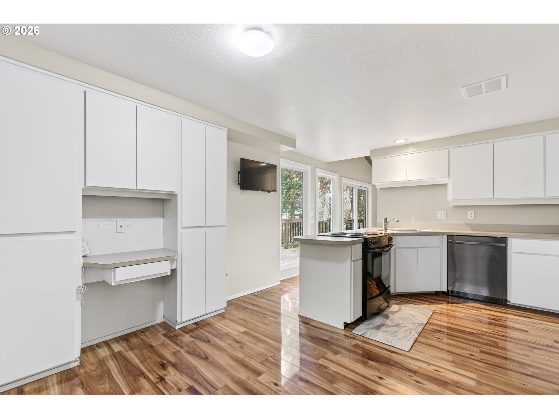 2090 Graham Drive Eugene, OR 97405 - Photo 10 of 30 a kitchen with a refrigerator and a stove top oven