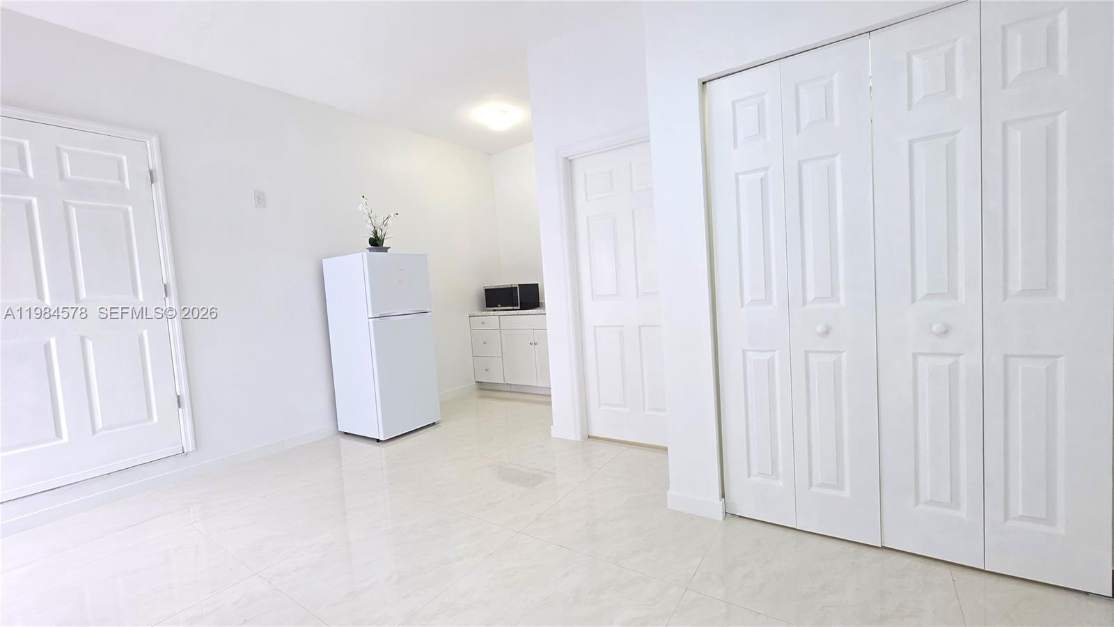 a view of a storage & utility room with a window