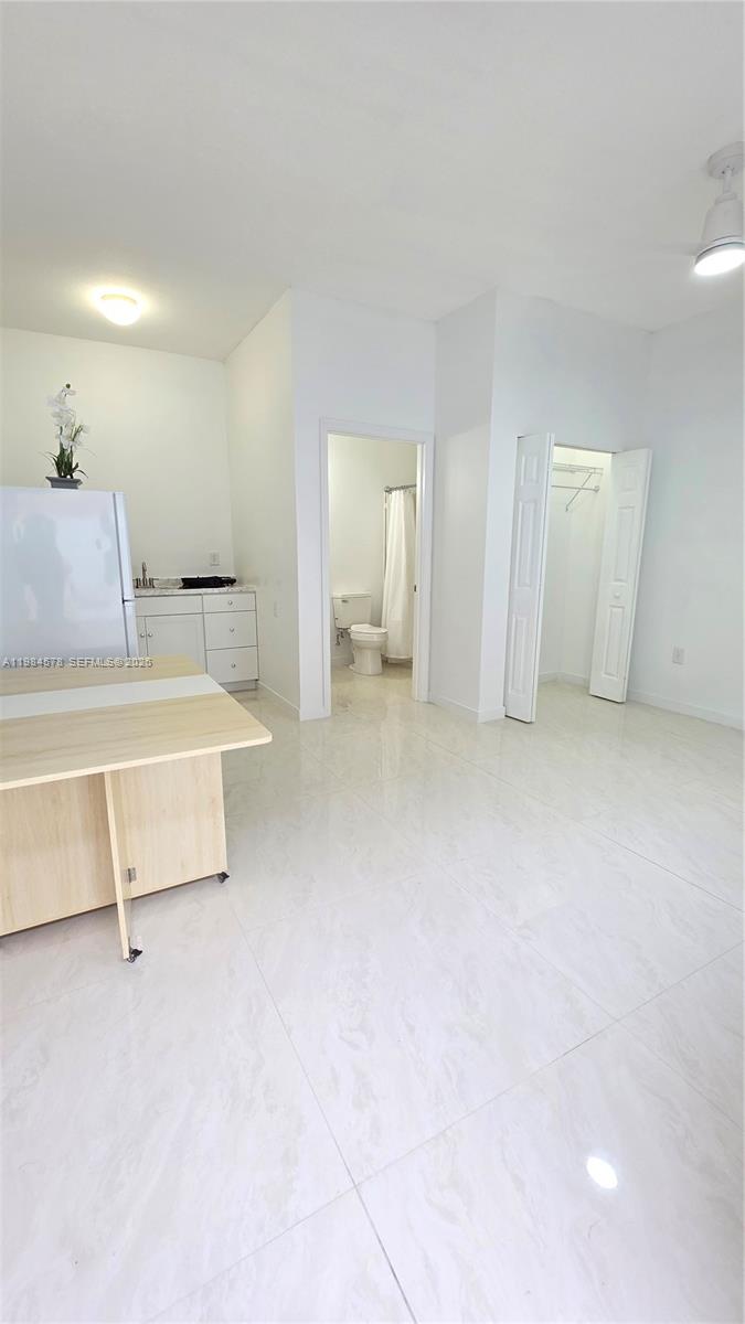 14552 Southwest 158th Court Miami, FL 33196 - Photo 14 of 21 a room with a bed and a couch