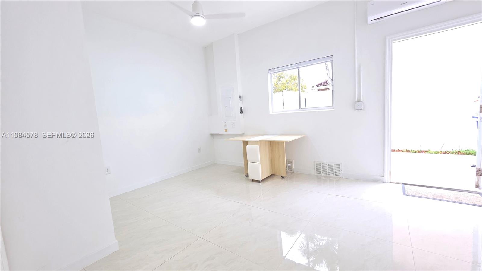 14552 Southwest 158th Court Miami, FL 33196 - Photo 5 of 21 an empty room with windows