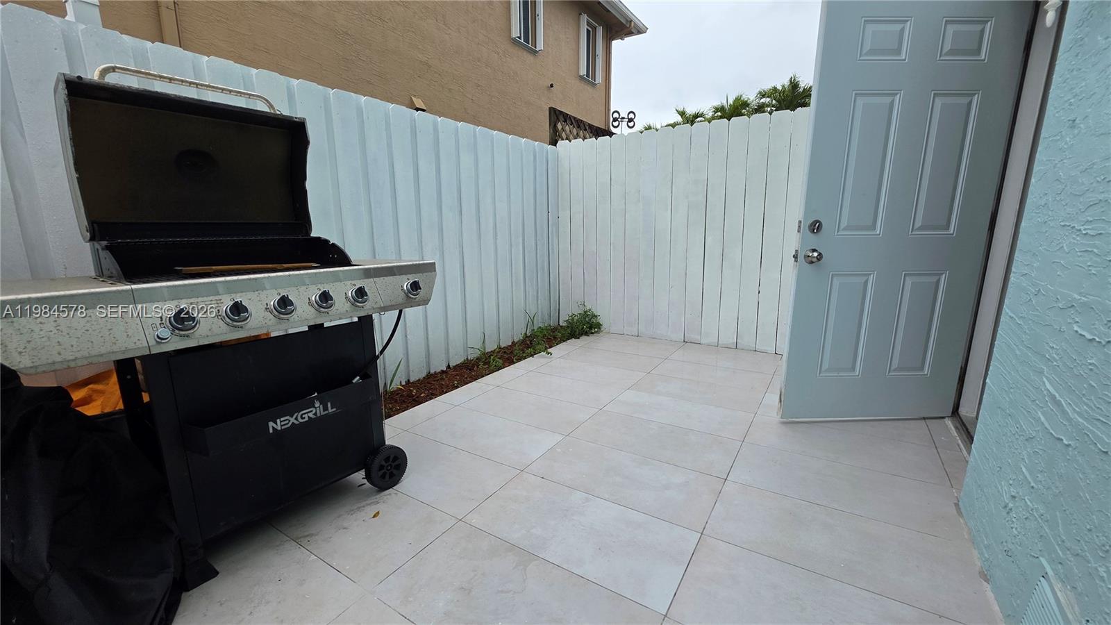 14552 Southwest 158th Court Miami, FL 33196 - Photo 7 of 21 a kitchen with stainless steel appliances a stove and a microwave oven