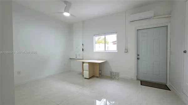 an entryway and window in a room