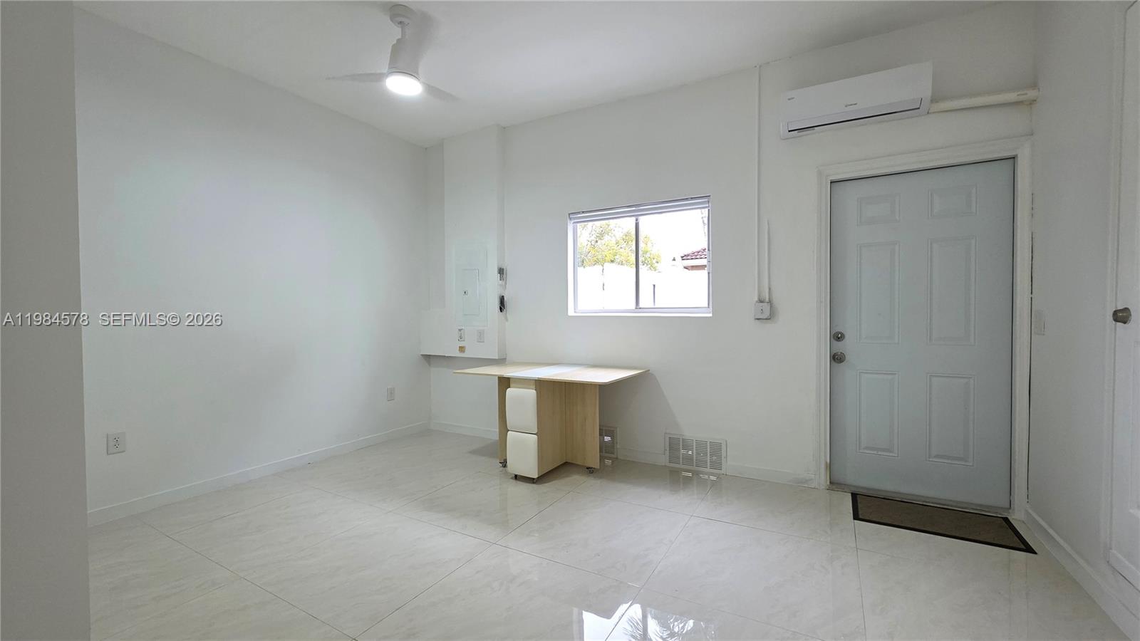 14552 Southwest 158th Court Miami, FL 33196 - Photo 8 of 21 an entryway and window in a room