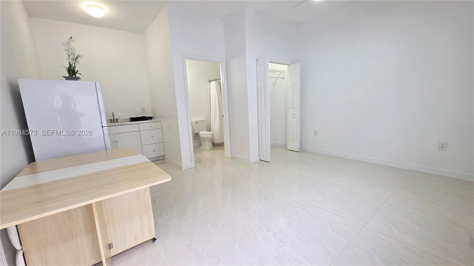 14552 Southwest 158th Court Miami, FL 33196 - Photo 10 of 21 a room with a table and chairs