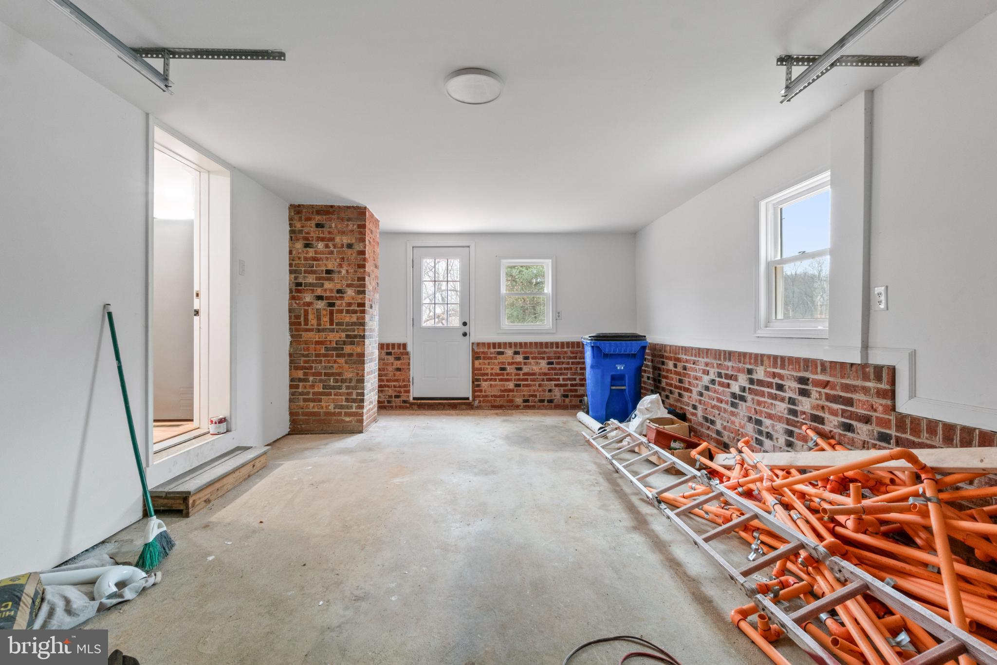 6411 Fulmer Road Frederick, MD 21703 - Photo 22 of 36 Spacious garage with brick accents.