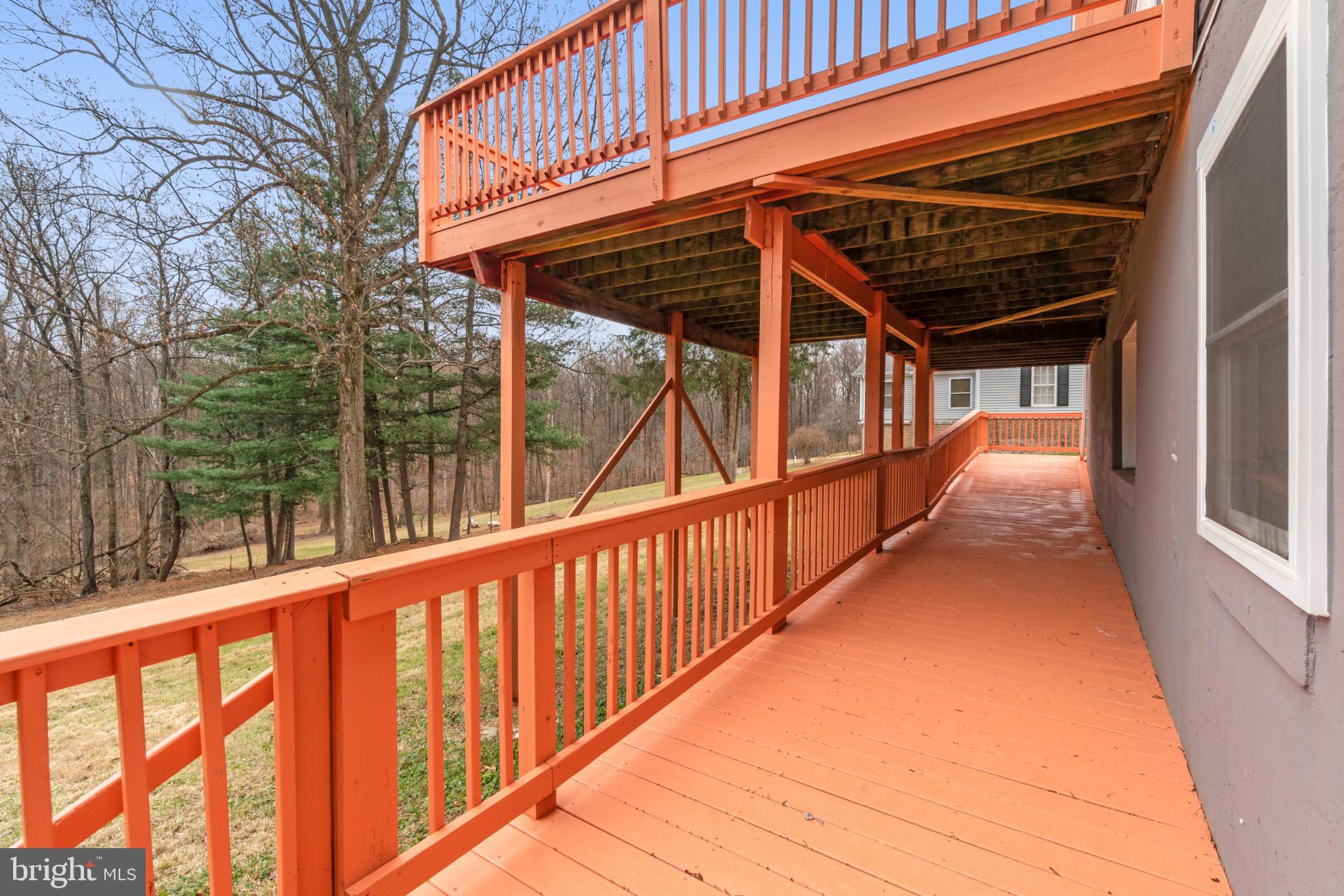 6411 Fulmer Road Frederick, MD 21703 - Photo 33 of 36 Charming deck with scenic woodland views.