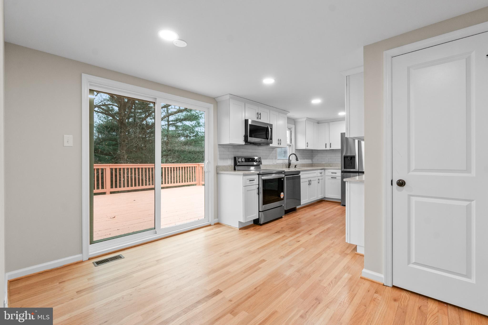 6411 Fulmer Road Frederick, MD 21703 - Photo 9 of 36 Bright kitchen with deck access and modern fini...