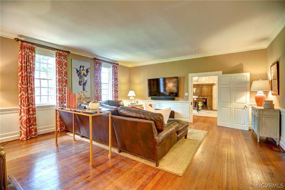 1 South Ridge Road Henrico, VA 23229 - Photo 18 of 50 a living room with furniture a flat screen tv and wooden floor