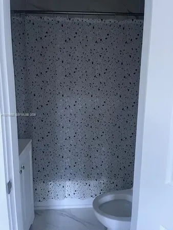 a bathroom with a toilet and a sink