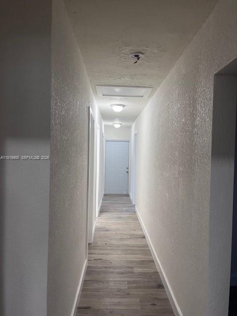 21221 Southwest 120th Avenue Miami, FL 33177 - Photo 14 of 38 a view of a hallway with wooden floor