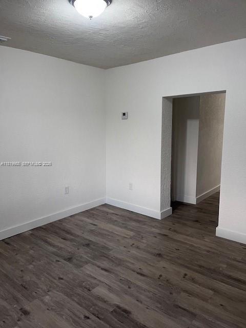 21221 Southwest 120th Avenue Miami, FL 33177 - Photo 16 of 38 a view of an empty room with wooden floor