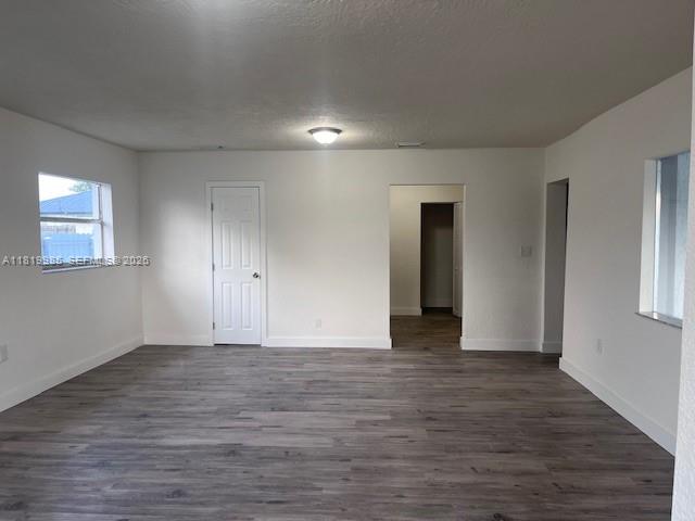 21221 Southwest 120th Avenue Miami, FL 33177 - Photo 2 of 38 a view of an empty room with wooden floor and a window