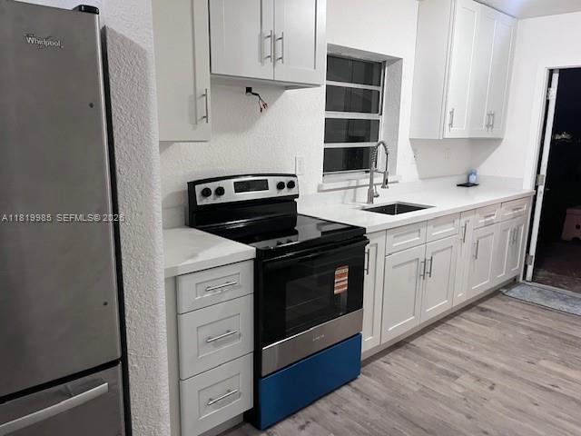 21221 Southwest 120th Avenue Miami, FL 33177 - Photo 38 of 38 a kitchen with cabinets appliances and wooden floor