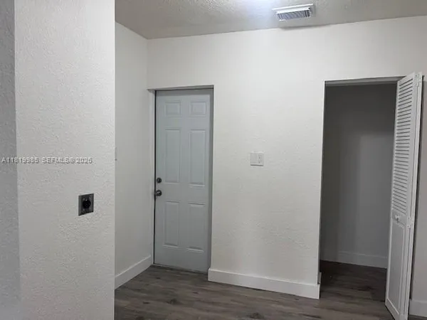 a view of bathroom with wooden floor