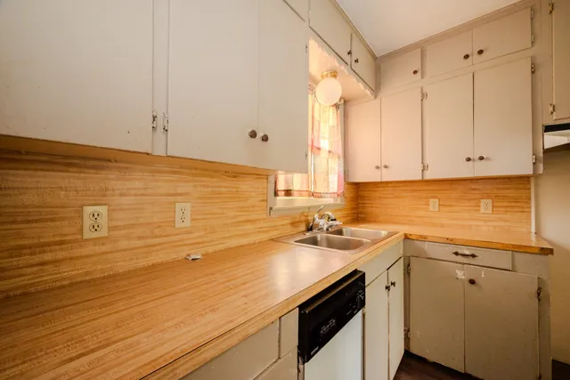 a view of a kitchen with a sink