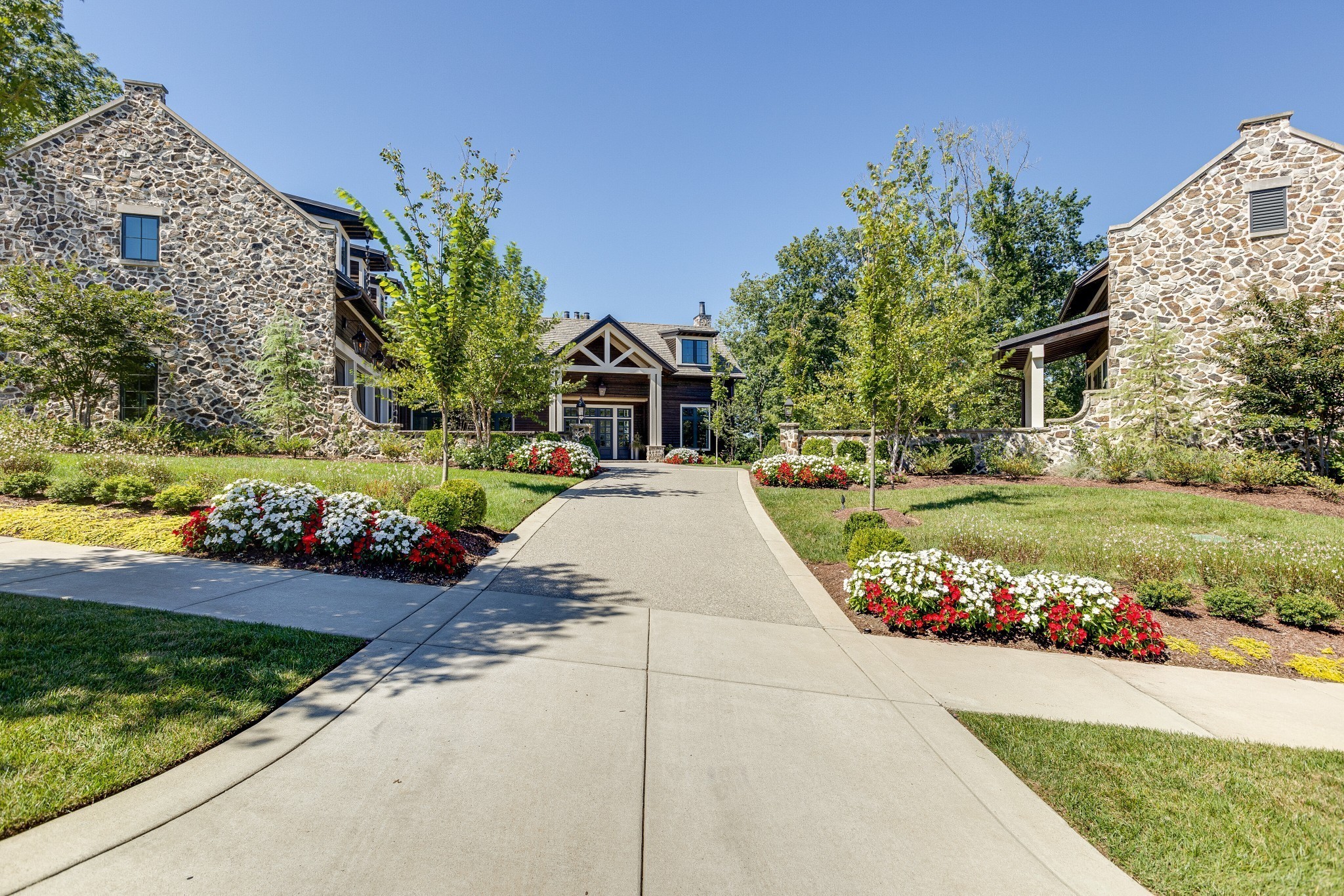 8455 Heirloom Boulevard College Grove, TN 37046 - Photo 2 of 69 a view of a garden with flowers and buildings