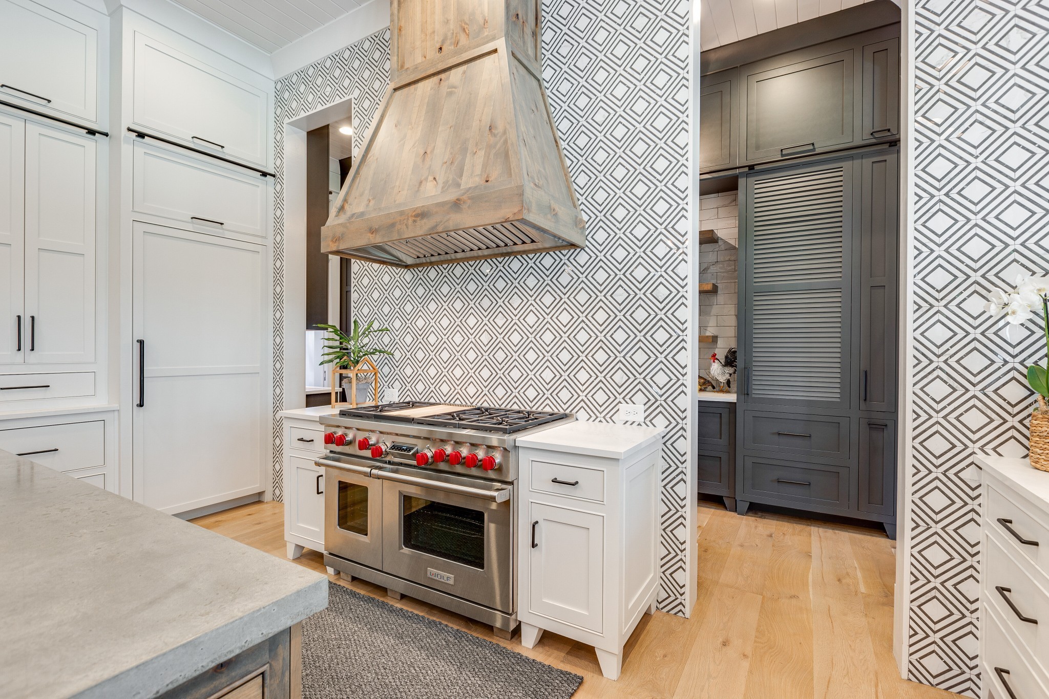 8455 Heirloom Boulevard College Grove, TN 37046 - Photo 29 of 69 a kitchen with a stove and a white cabinets