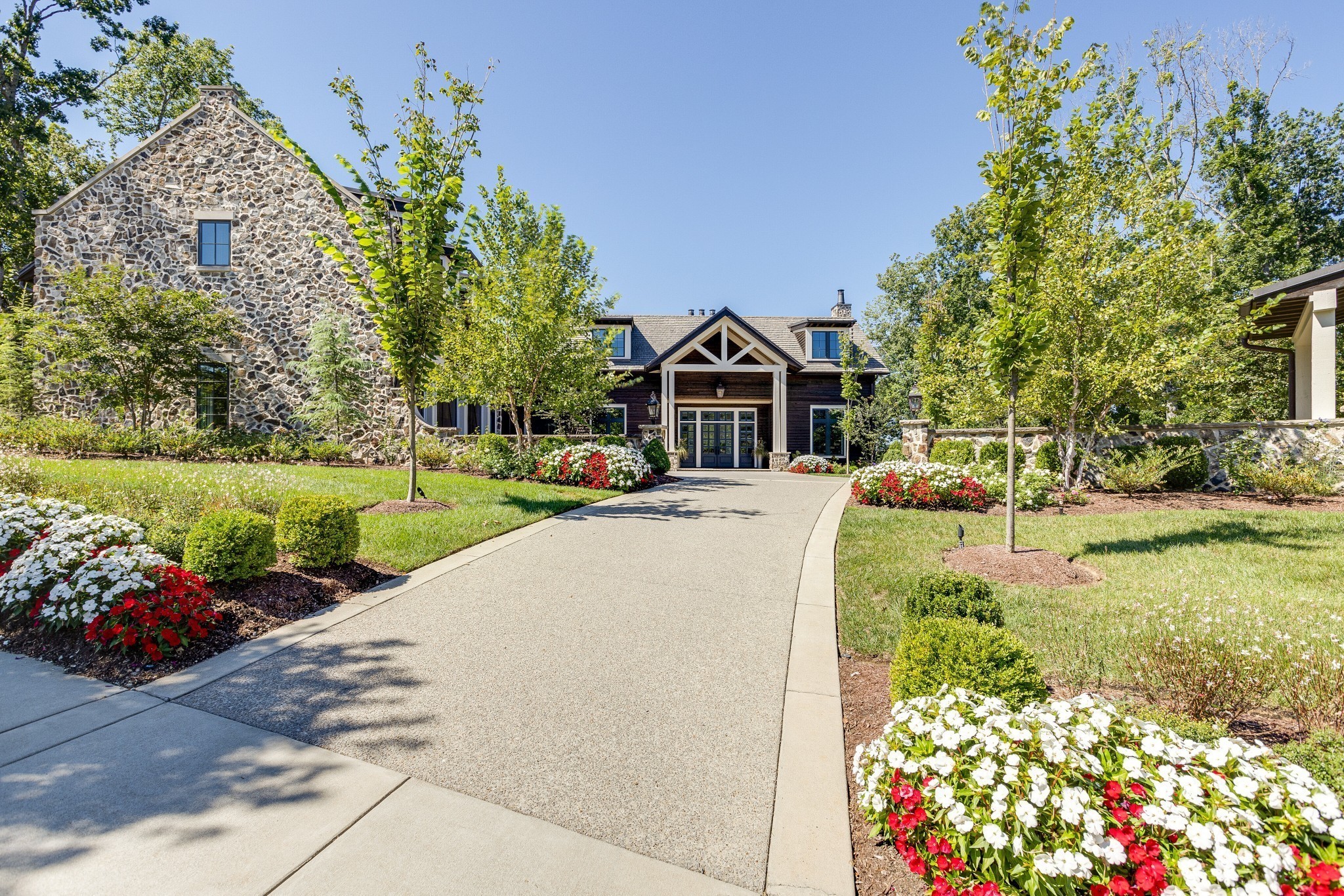 8455 Heirloom Boulevard College Grove, TN 37046 - Photo 3 of 69 a view of a house with a yard and garden