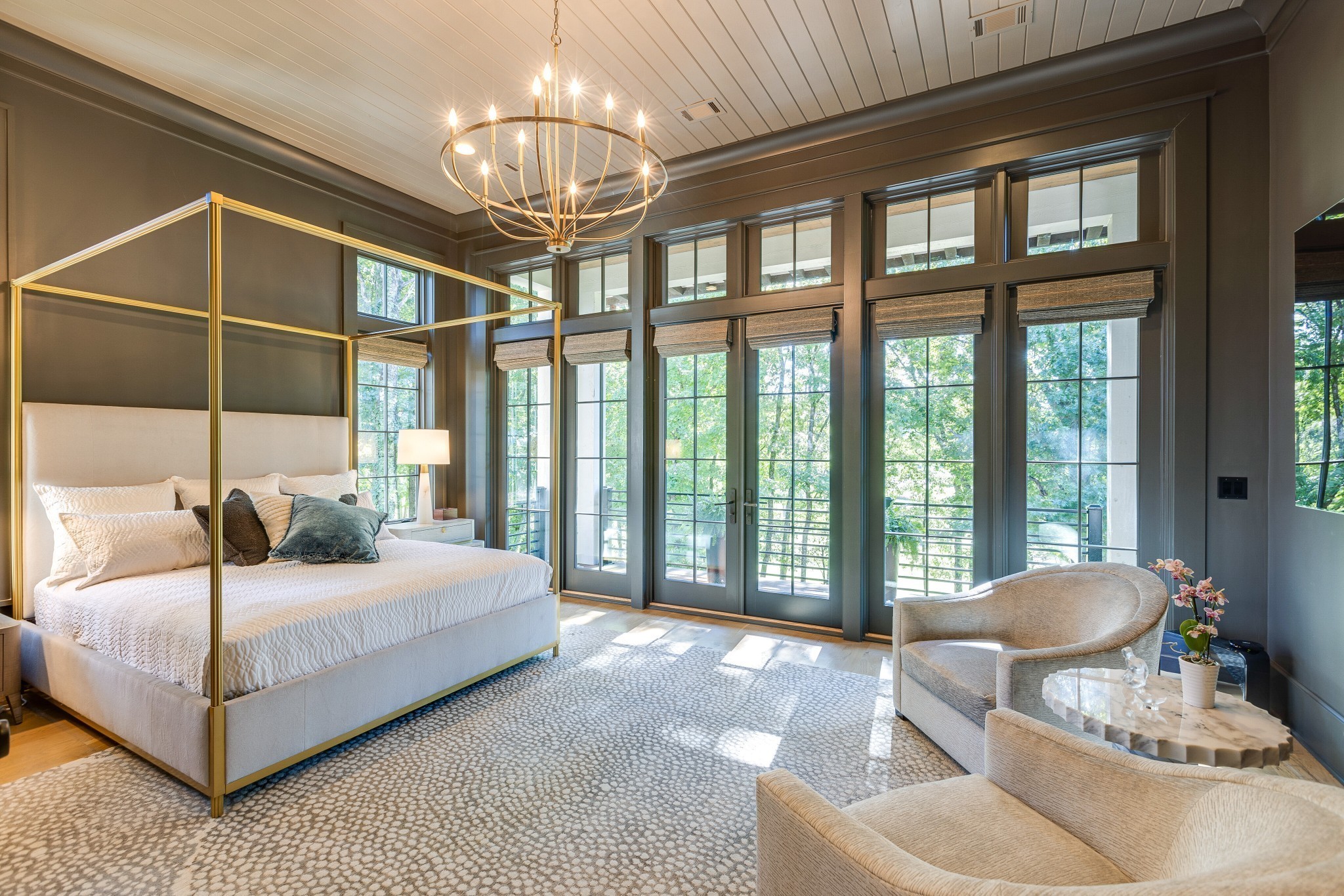 8455 Heirloom Boulevard College Grove, TN 37046 - Photo 34 of 69 a bedroom with a large bed and a chandelier