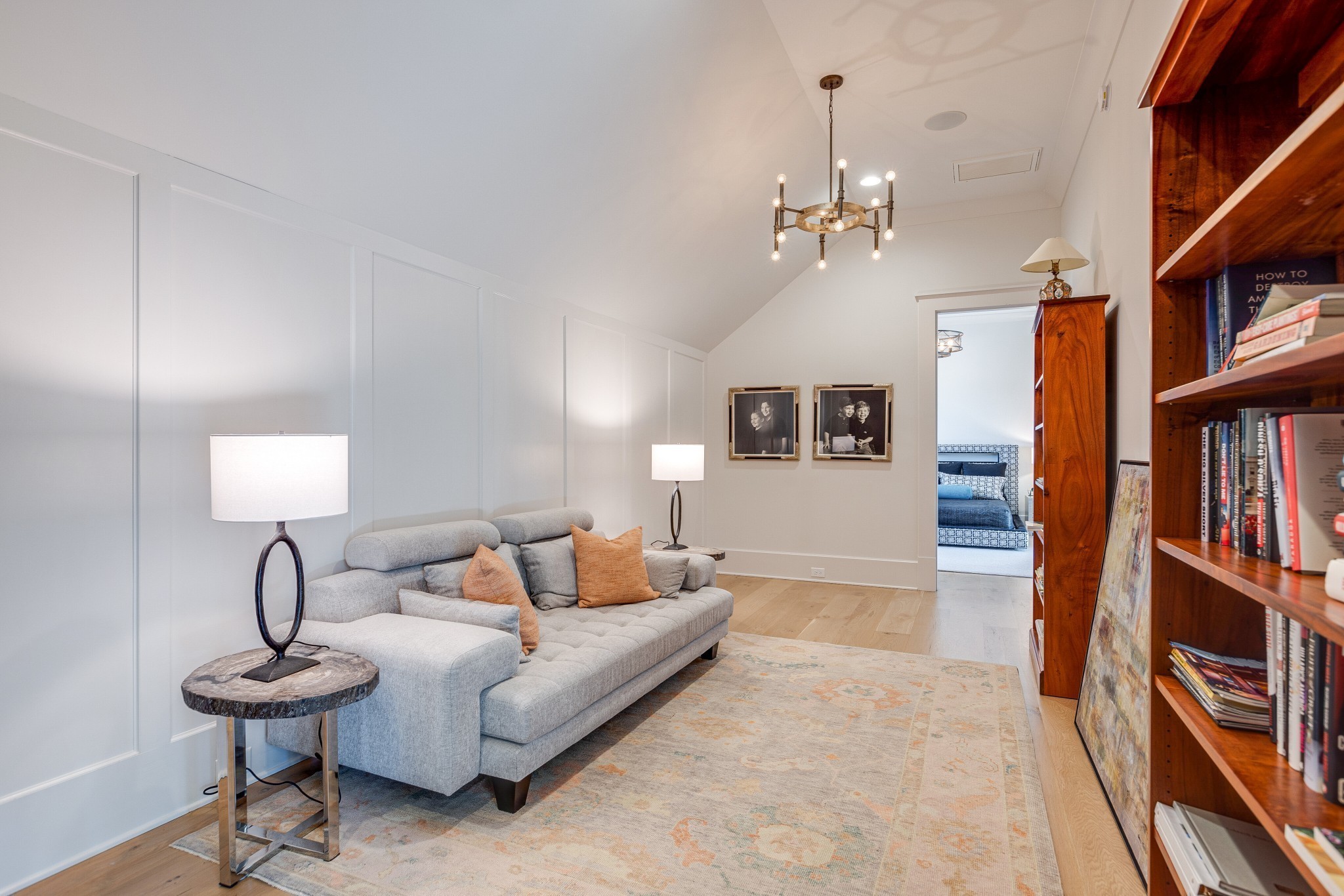 8455 Heirloom Boulevard College Grove, TN 37046 - Photo 42 of 69 a living room with furniture a lamp and a book shelf