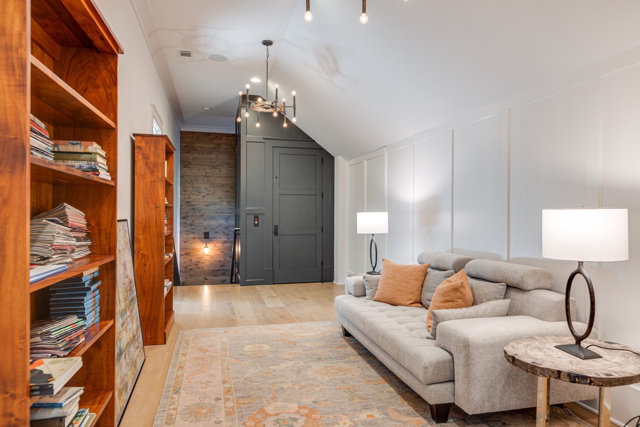 8455 Heirloom Boulevard College Grove, TN 37046 - Photo 43 of 69 a living room with furniture and a chandelier