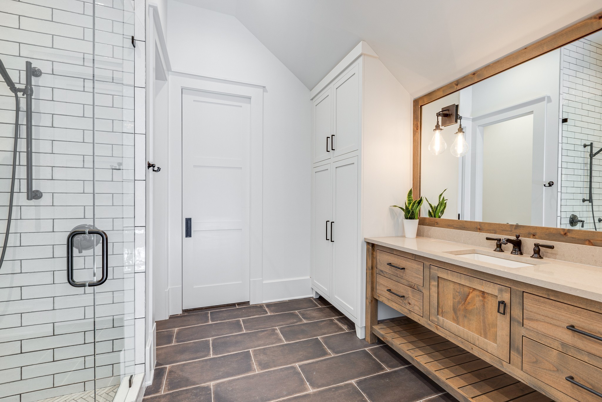 8455 Heirloom Boulevard College Grove, TN 37046 - Photo 45 of 69 a bathroom with a double vanity sink a mirror and shower