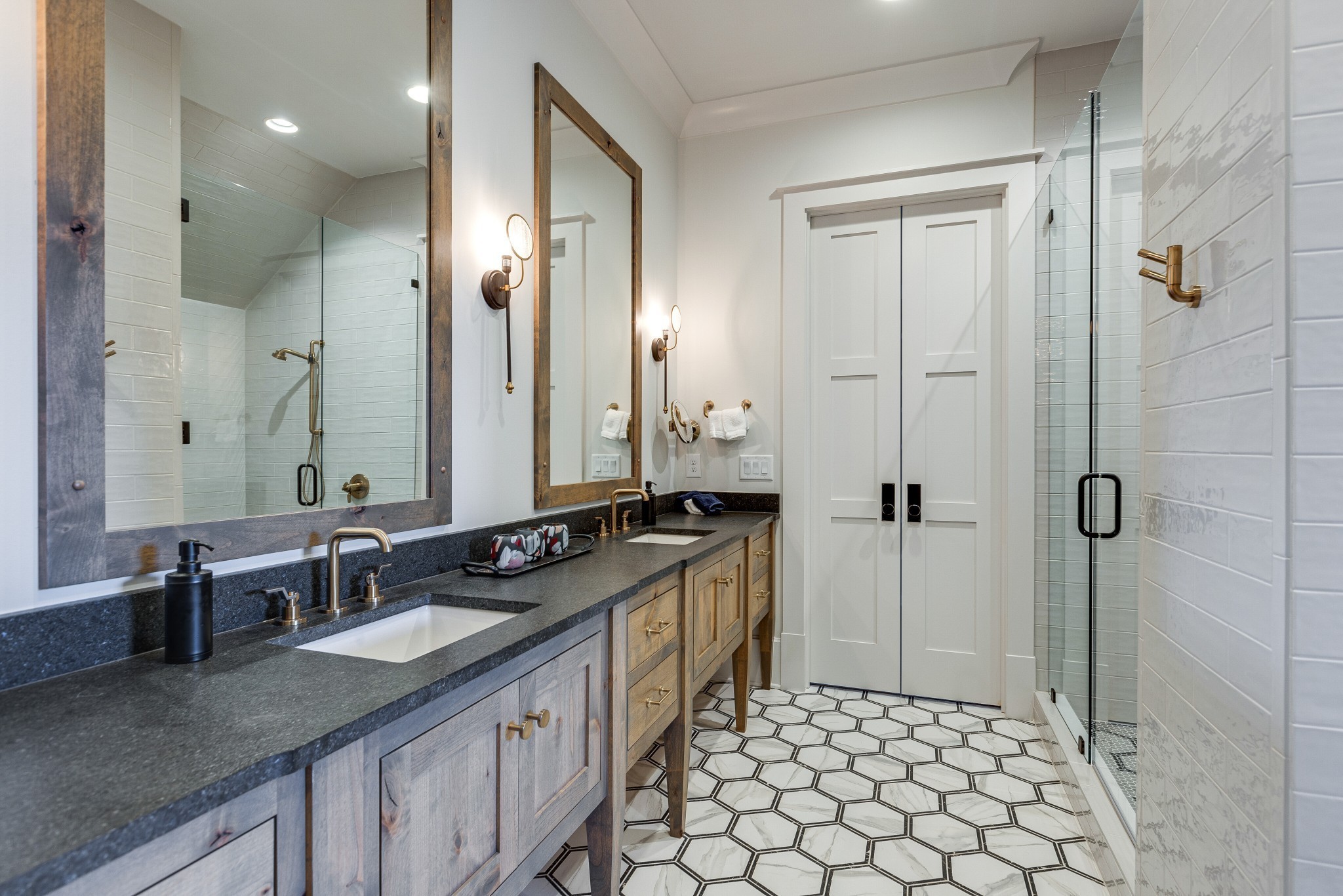 8455 Heirloom Boulevard College Grove, TN 37046 - Photo 50 of 69 a bathroom with a granite countertop sink a mirror a and a shower