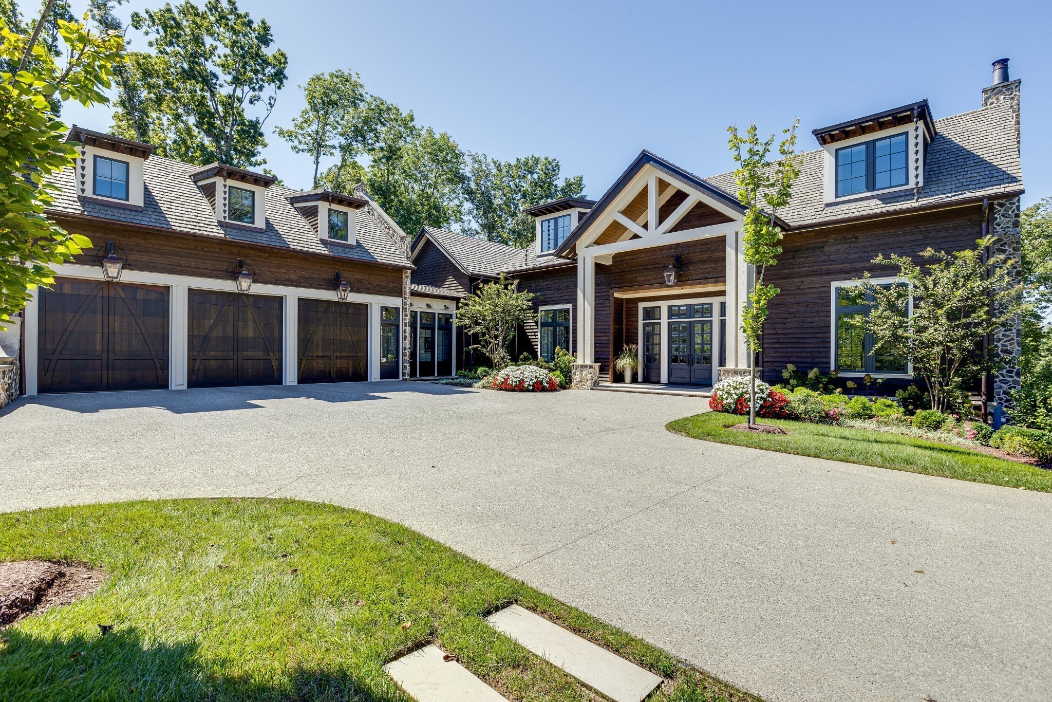 8455 Heirloom Boulevard College Grove, TN 37046 - Photo 5 of 69 a front view of a house with a yard and garage