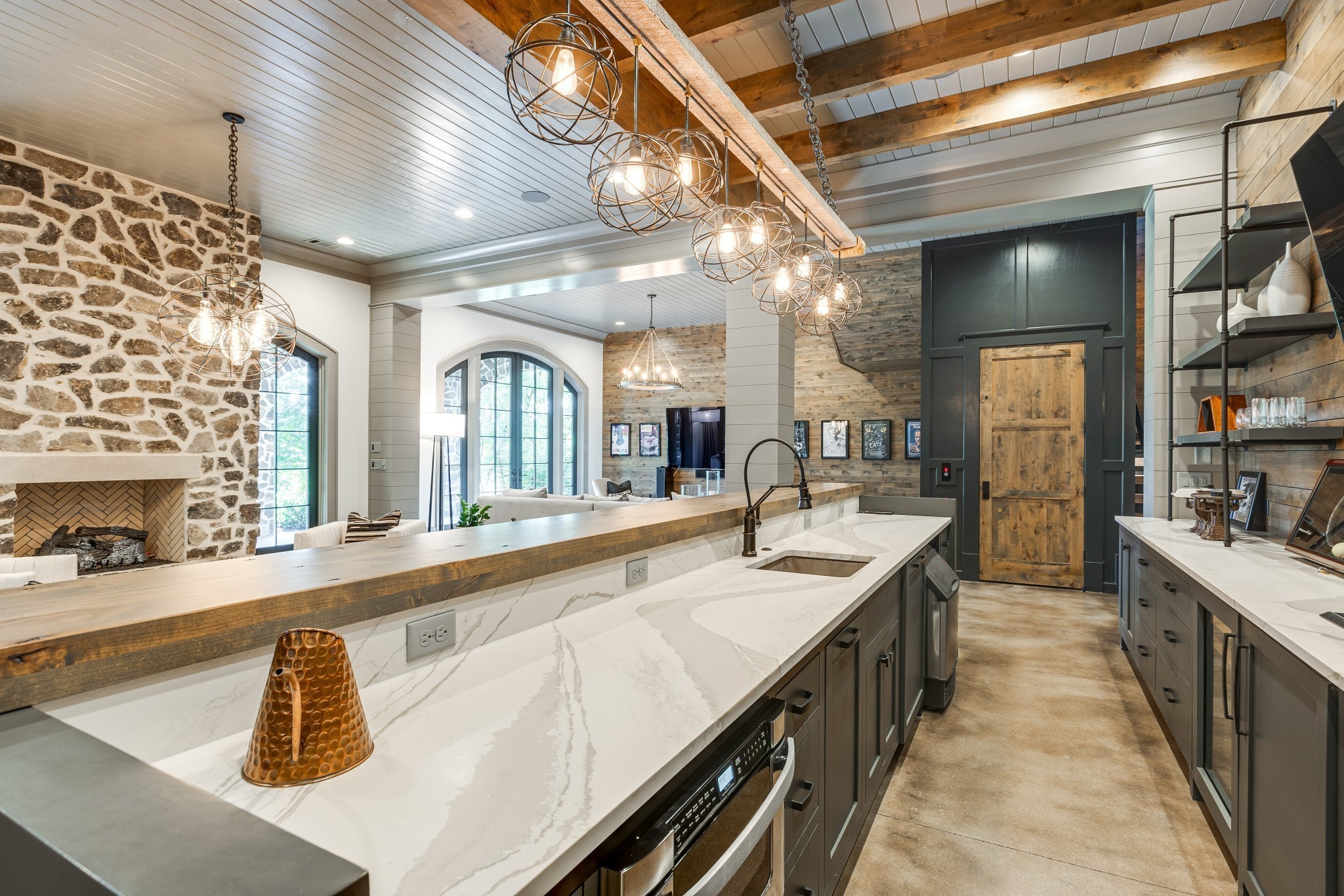 8455 Heirloom Boulevard College Grove, TN 37046 - Photo 59 of 69 a large kitchen with kitchen island a large counter space a sink and stainless steel appliances