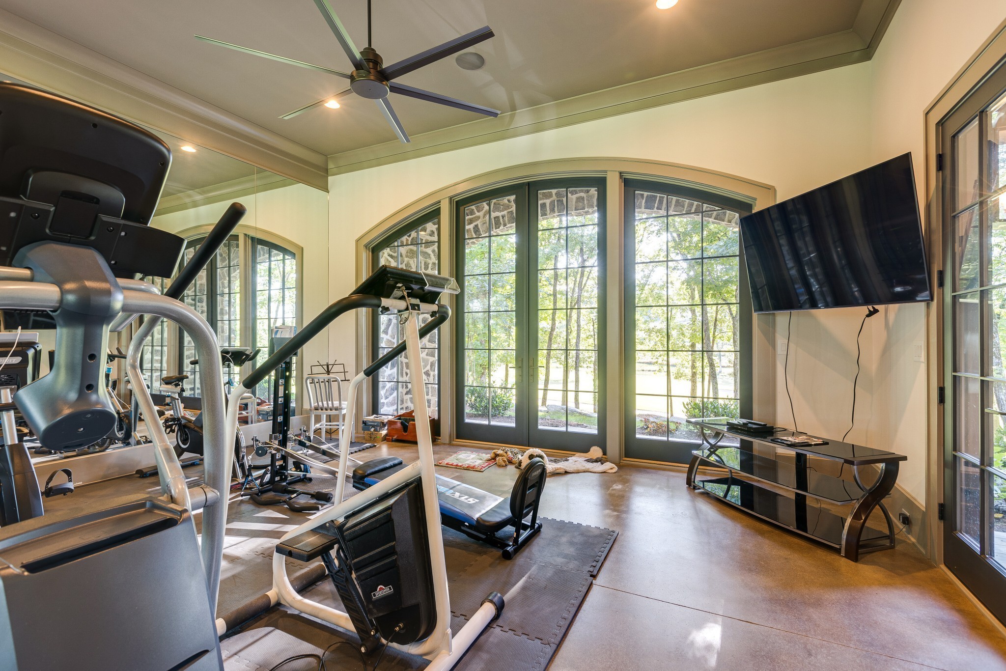 8455 Heirloom Boulevard College Grove, TN 37046 - Photo 61 of 69 a living room with furniture a flat screen tv and a large window