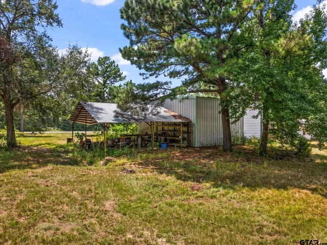 a backyard of a house with lots of green space