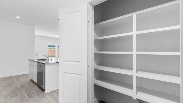 a kitchen with a stove and a refrigerator
