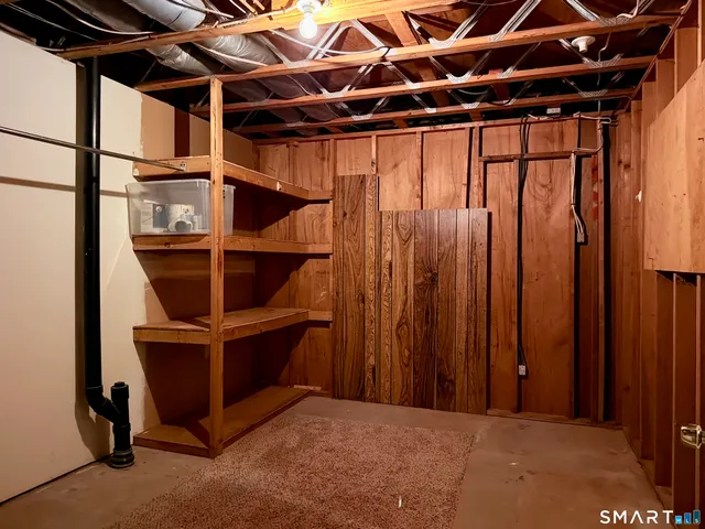 a view of an empty room with shelf