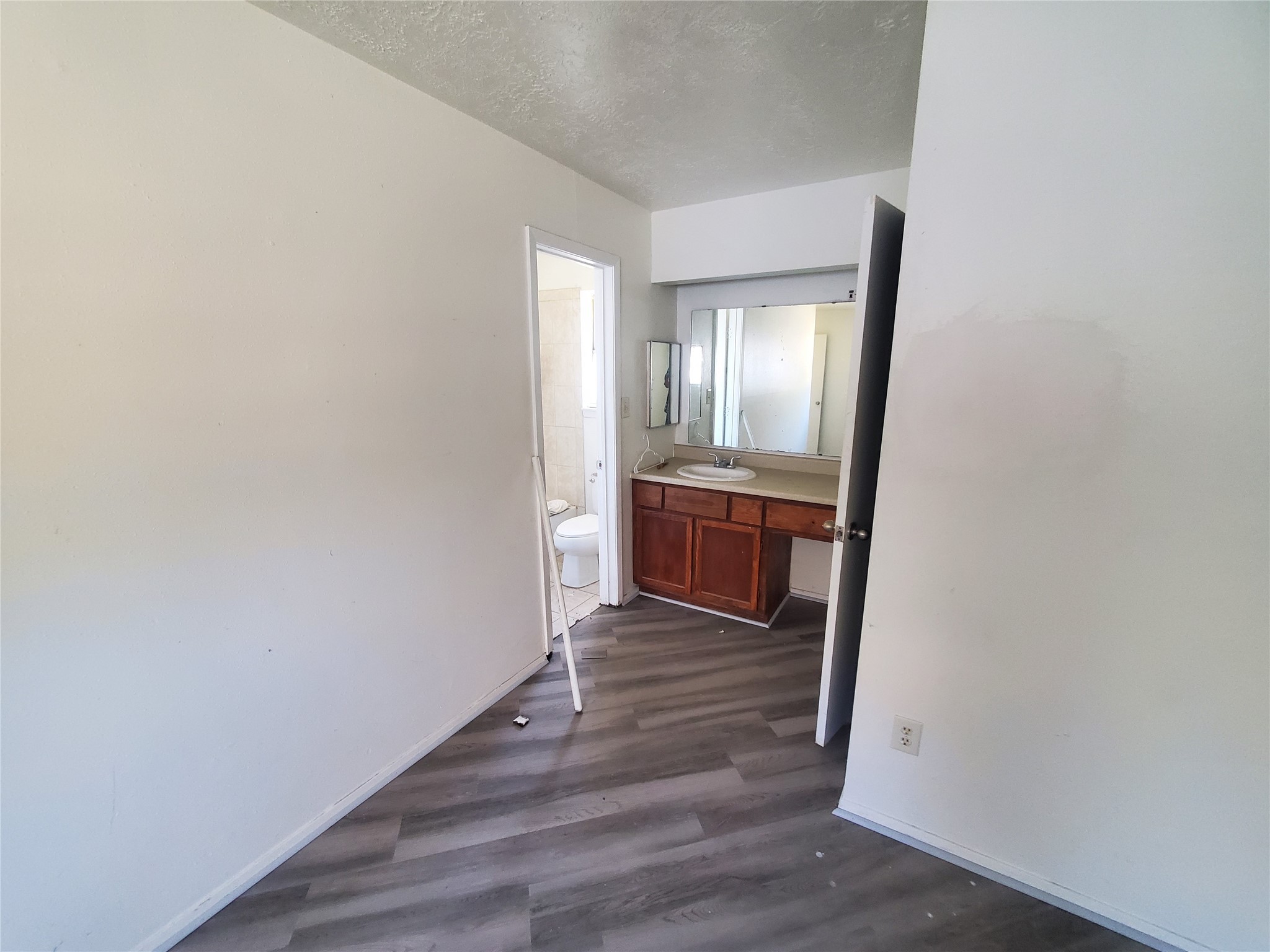 6518 Brookgate Drive Spring, TX 77373 - Photo 12 of 14 a view of a hallway with wooden floor