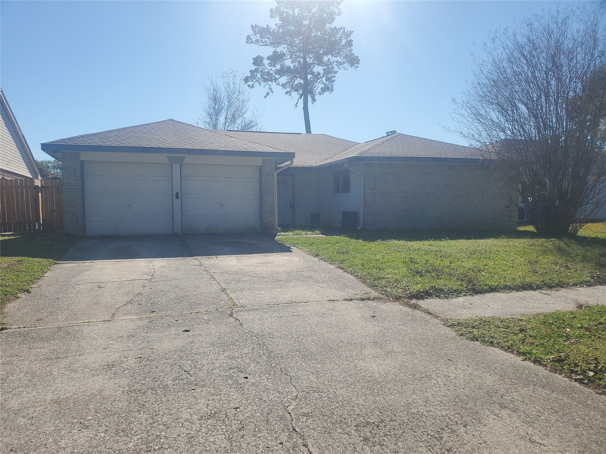 6518 Brookgate Drive Spring, TX 77373 - Photo 2 of 14 a front view of a house with a yard and garage