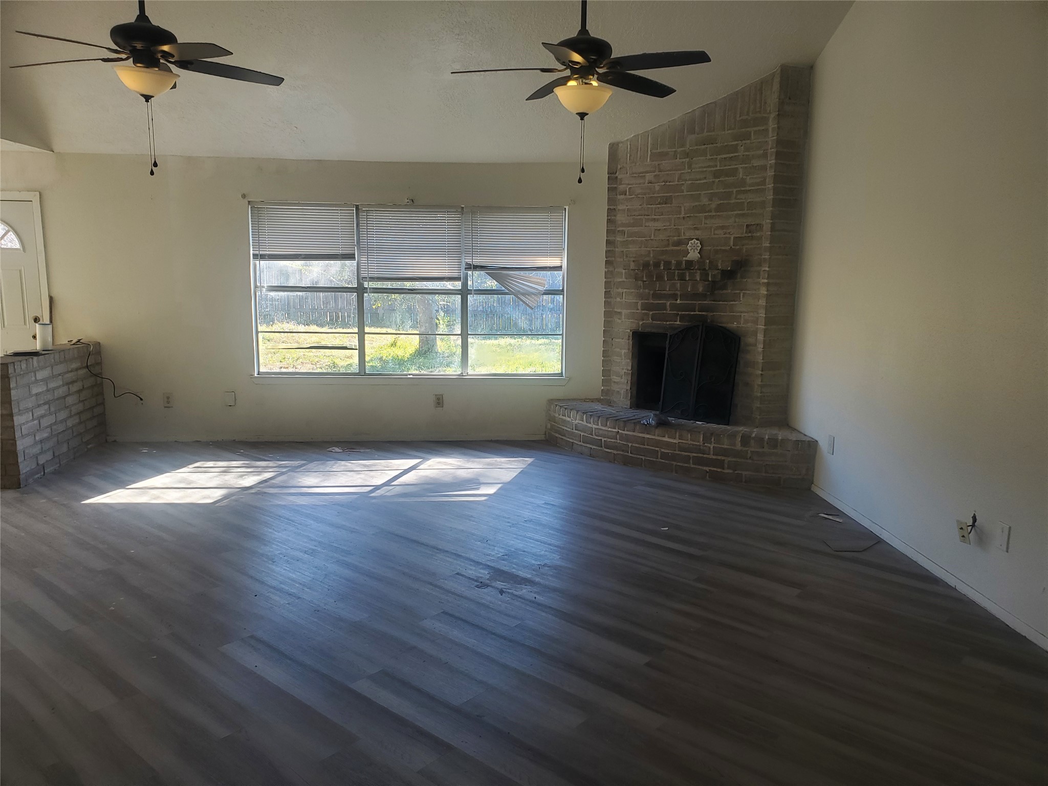 6518 Brookgate Drive Spring, TX 77373 - Photo 5 of 14 a view of empty room with wooden floor and fan