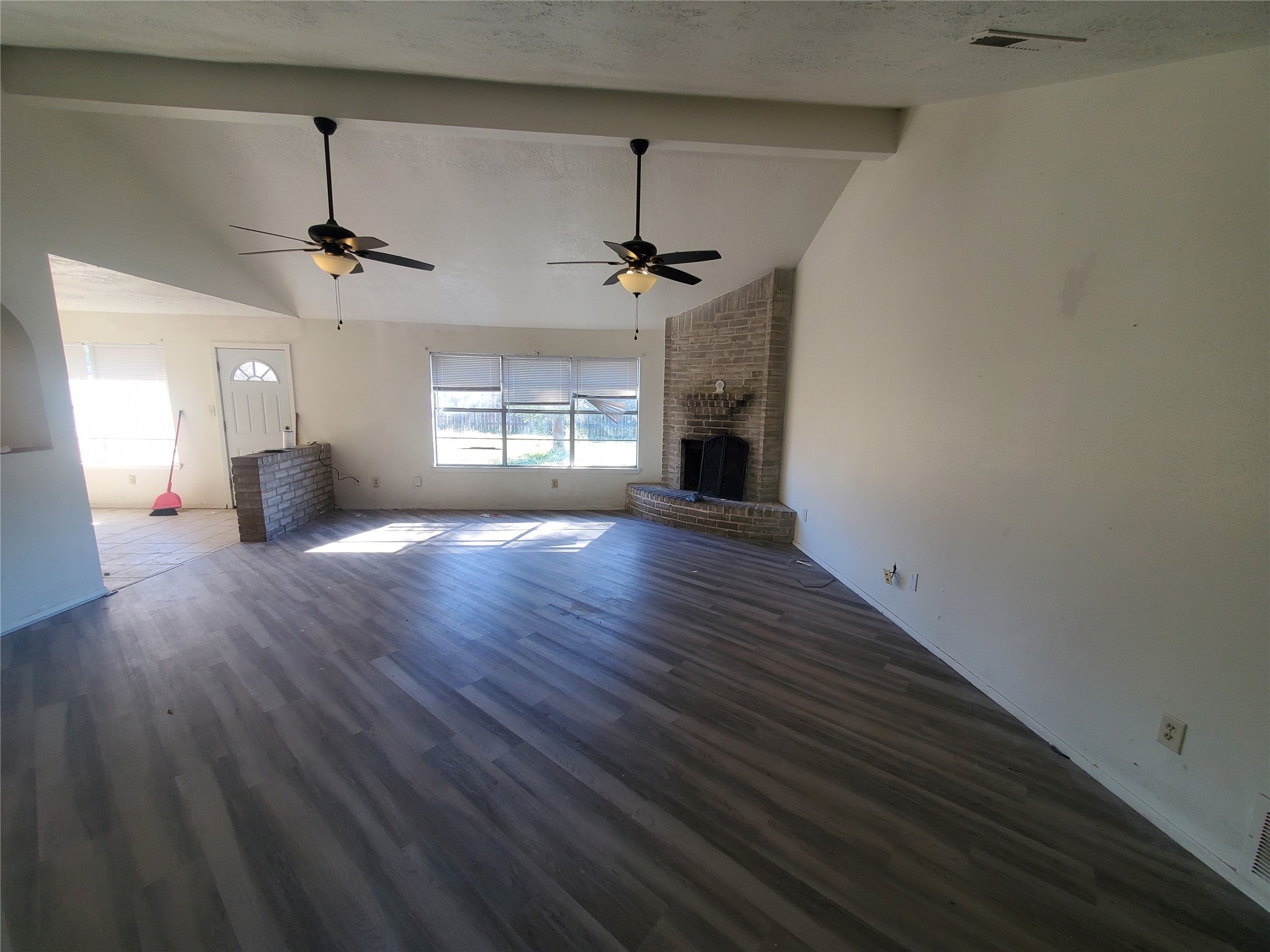 6518 Brookgate Drive Spring, TX 77373 - Photo 6 of 14 a view of an empty room with window and wooden floor