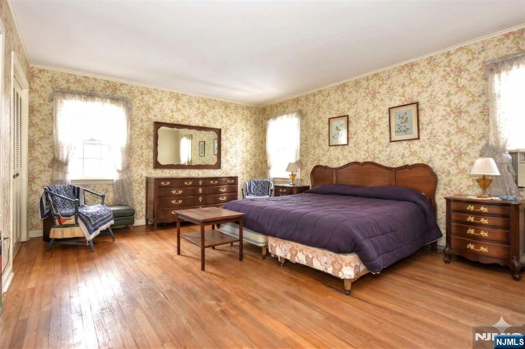 40 Hering Road Montvale, NJ 07645 - Photo 13 of 29 a spacious bedroom with a bed a table and chair