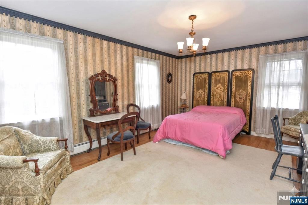 40 Hering Road Montvale, NJ 07645 - Photo 16 of 29 a spacious bedroom with a bed and large windows