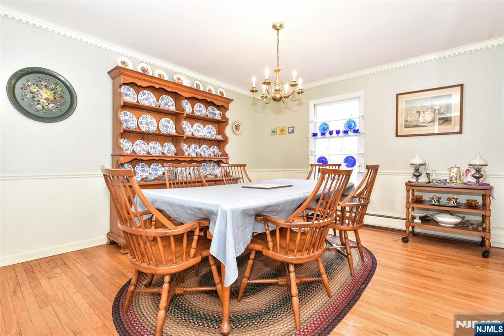 40 Hering Road Montvale, NJ 07645 - Photo 5 of 29 a view of a dining room with furniture and wooden floor