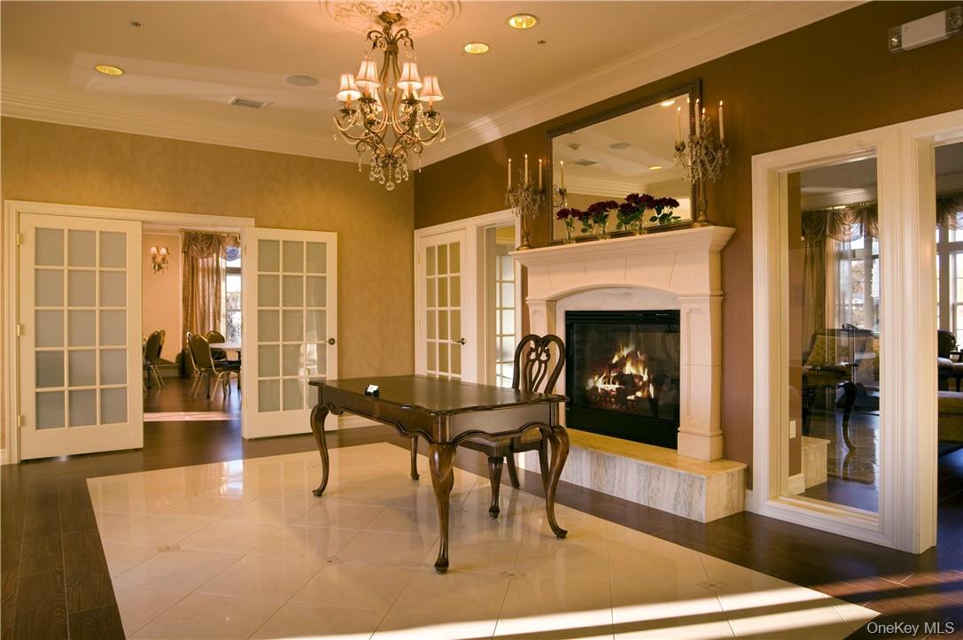 422 Tower Ridge Circle, Unit 422 Middletown, NY 10941 - Photo 13 of 17 a living room with furniture a dining table and a fireplace