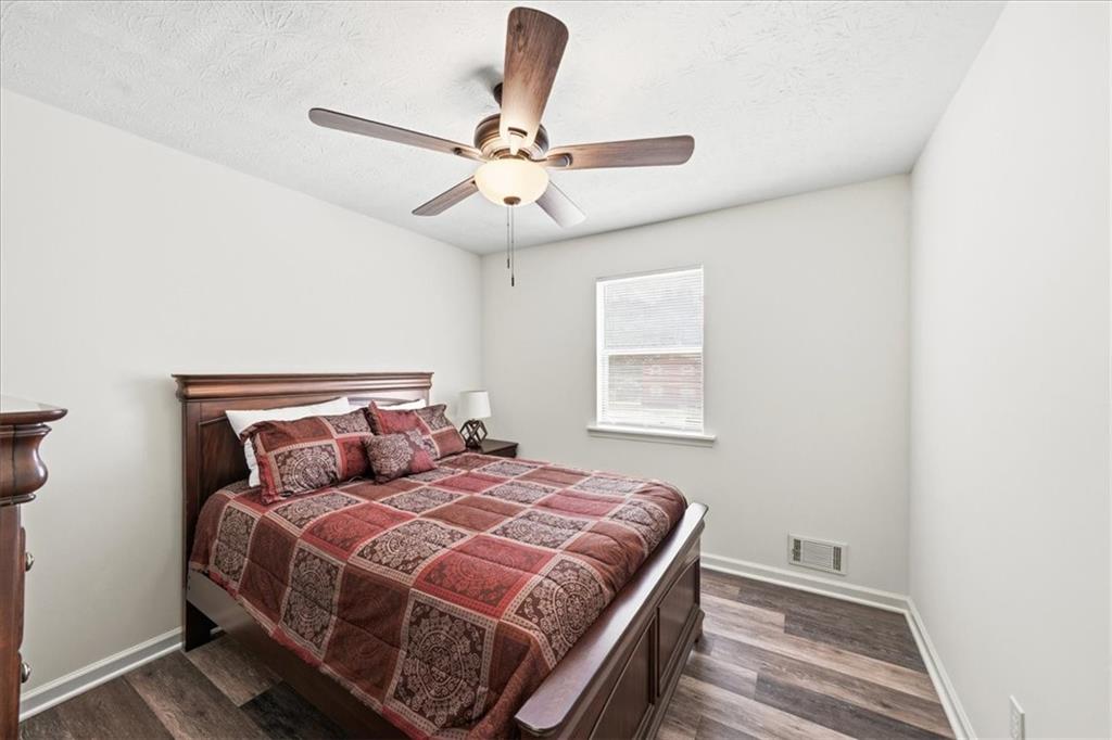2561 Ripple Way Lawrenceville, GA 30043 - Photo 12 of 19 a bedroom with a bed and window