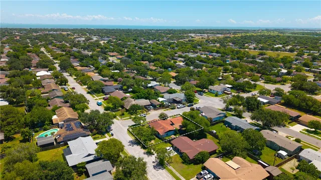 an aerial view of residential houses with outdoor space