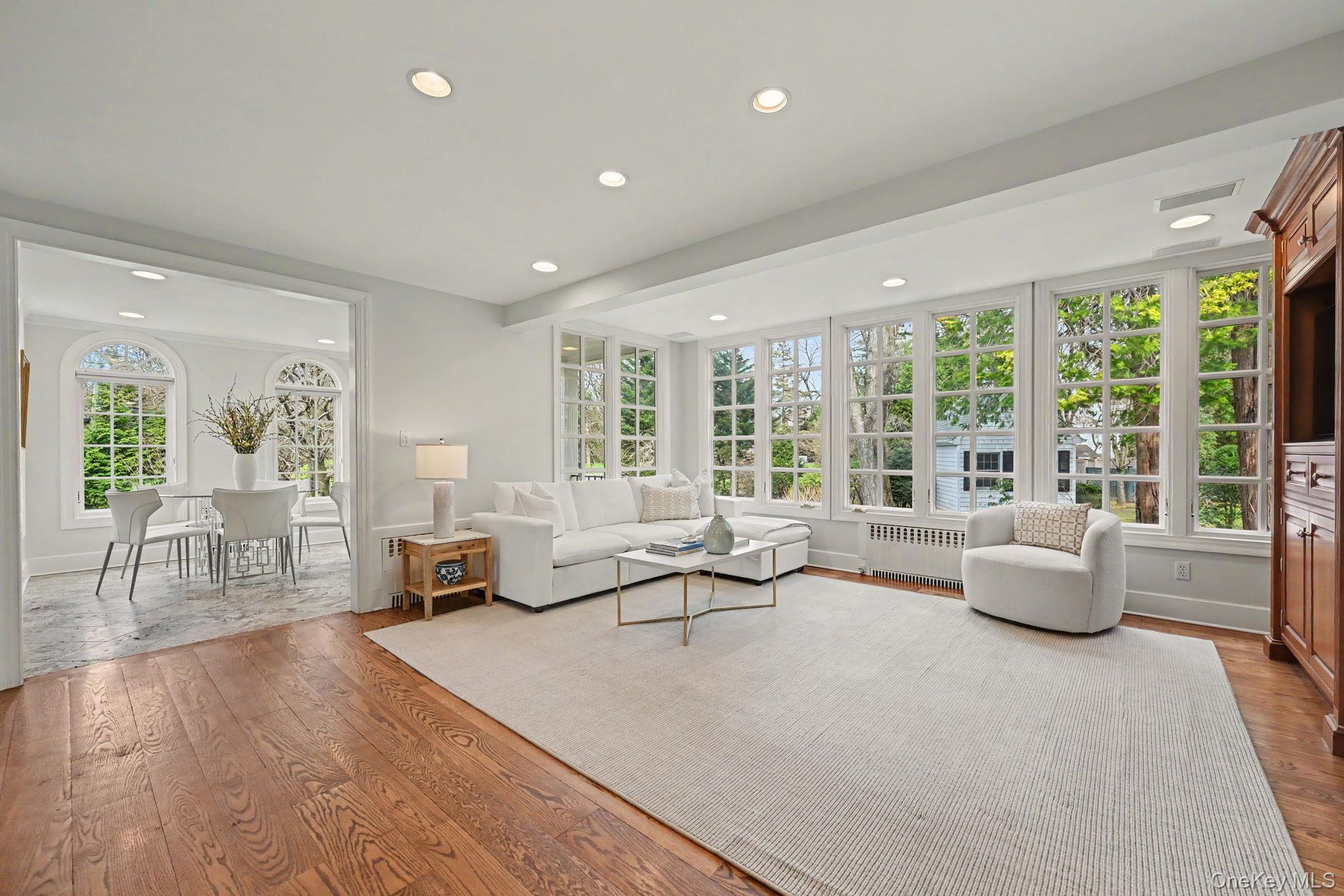 2 Park Drive South Rye, NY 10580 - Photo 11 of 50 a living room with furniture and large windows