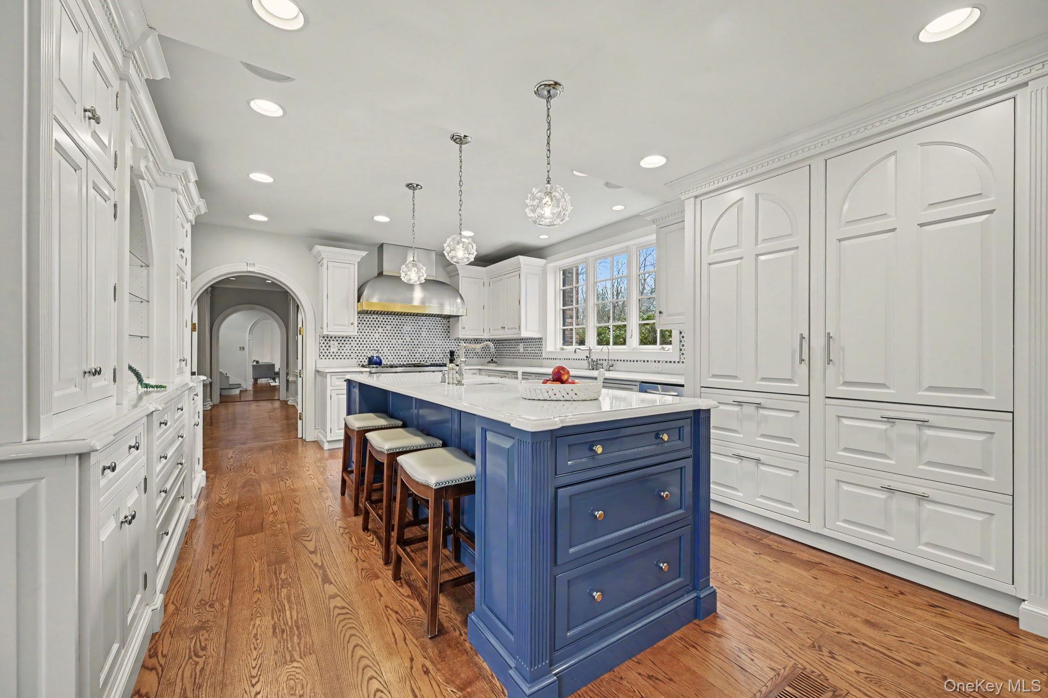 2 Park Drive South Rye, NY 10580 - Photo 19 of 50 a large kitchen with stainless steel appliances granite countertop a large center island a sink a stove and a refrigerator