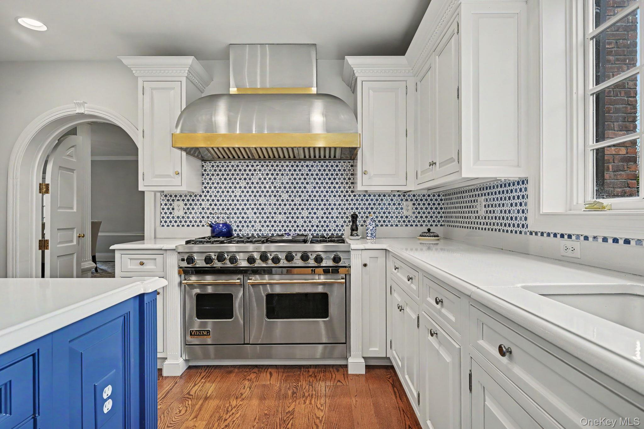 2 Park Drive South Rye, NY 10580 - Photo 22 of 50 a kitchen with a stove and white cabinets