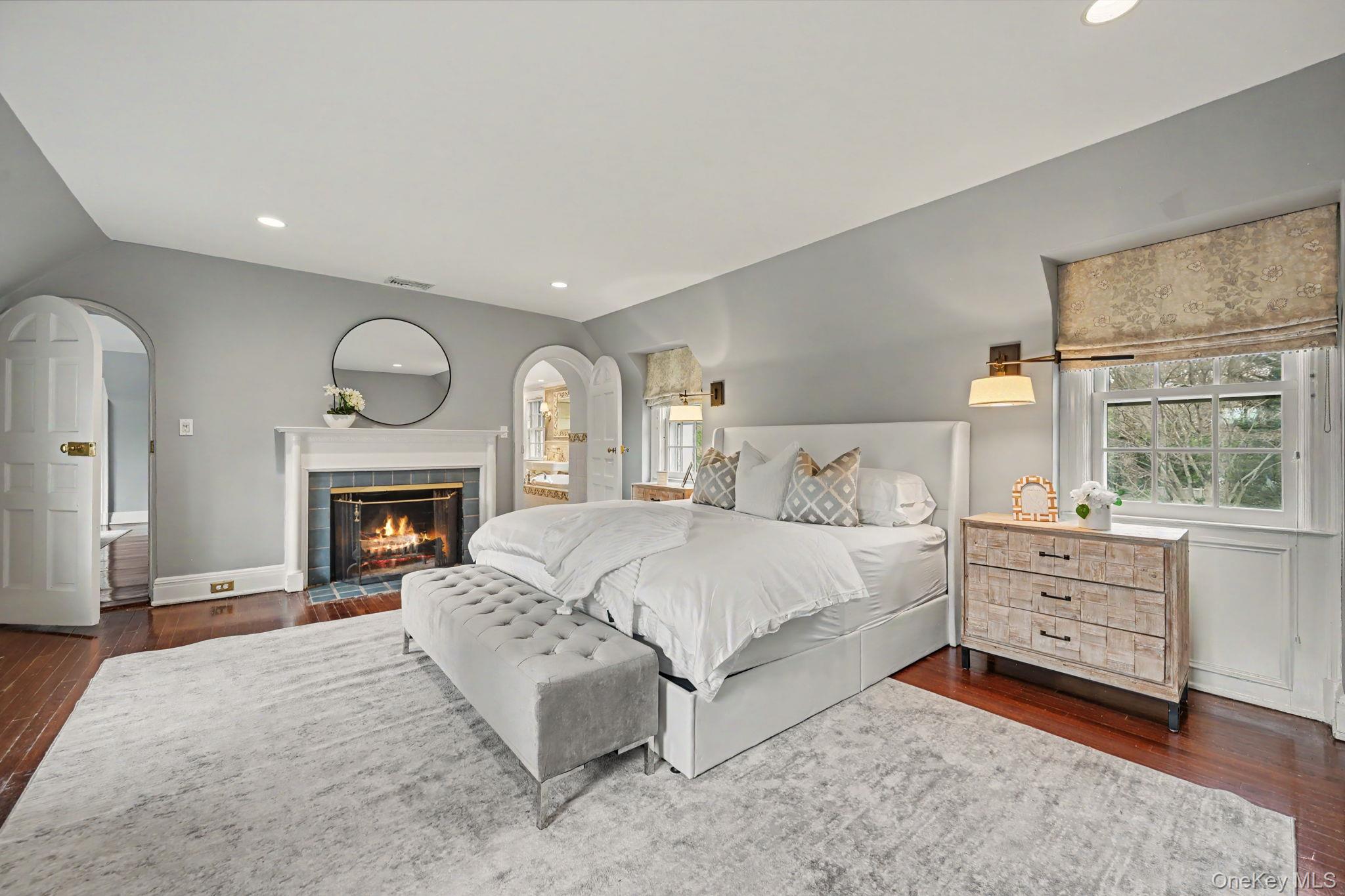 2 Park Drive South Rye, NY 10580 - Photo 24 of 50 a spacious bedroom with a bed and a fireplace