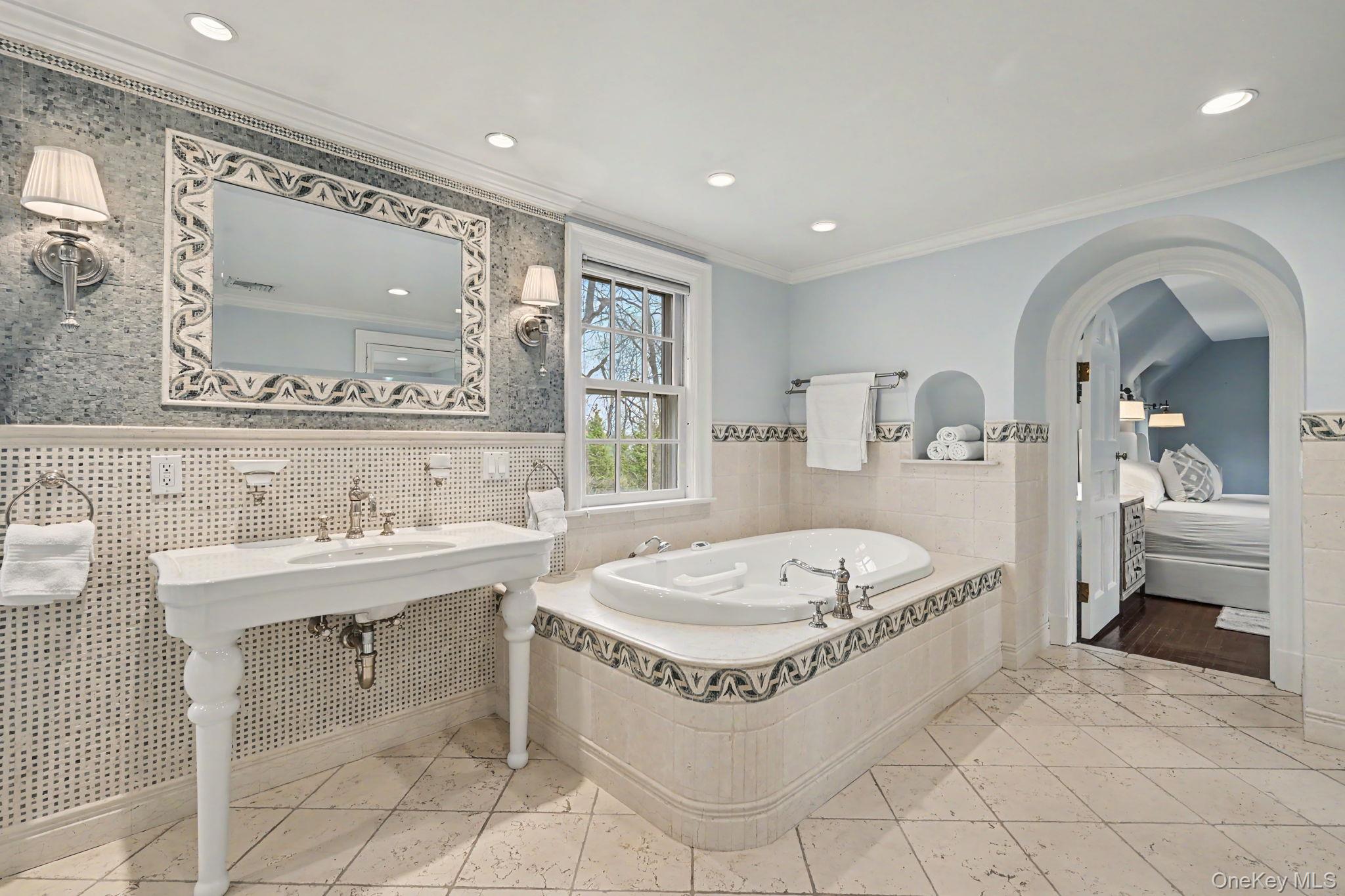2 Park Drive South Rye, NY 10580 - Photo 27 of 50 a spacious bathroom with a tub sink and mirror