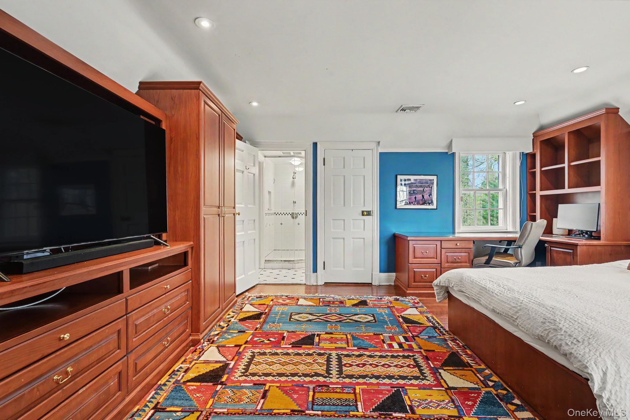 2 Park Drive South Rye, NY 10580 - Photo 35 of 50 a bedroom with two beds and a flat screen tv