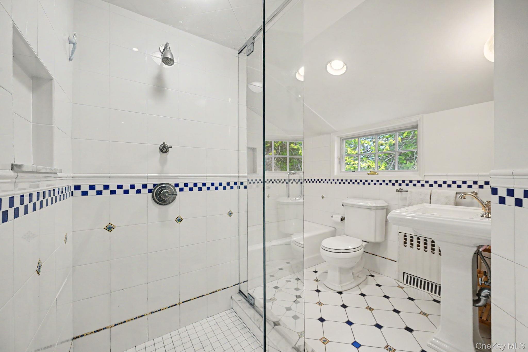2 Park Drive South Rye, NY 10580 - Photo 36 of 50 a bathroom with a granite countertop sink a toilet and shower